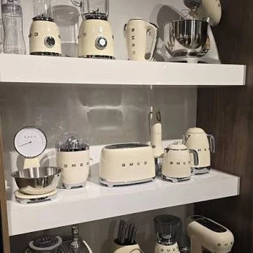 Customer photo — the collection arranged on open kitchen shelves